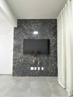 Uma televisão e/ou sistema de entretenimento em Casa em Condomínio Montserrat