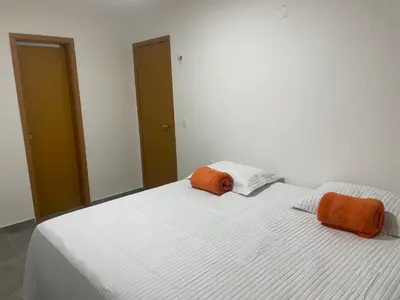 Uma cama ou camas num quarto em Casa em Condomínio Montserrat