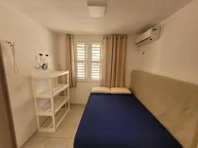Uma cama ou camas num quarto em MB07101 - Morro Branco - Térreo - 3 quartos - 2 suites - churrasqueira