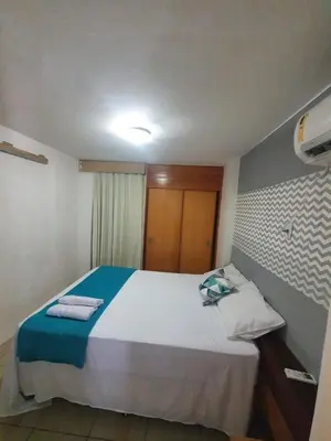 Uma cama ou camas num quarto em Praia Mansa Suíte Hotel