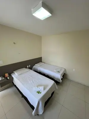 Uma cama ou camas num quarto em SD Plaza Hotel