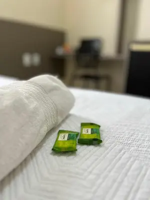 Uma cama ou camas num quarto em SD Plaza Hotel