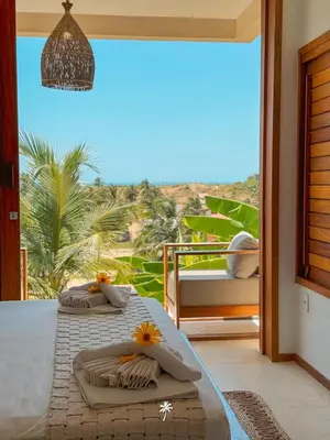 Uma cama ou camas num quarto em La Villa Dune, um luxo com vista espetacular por mar e coqueiral ! Uma experiência unica !