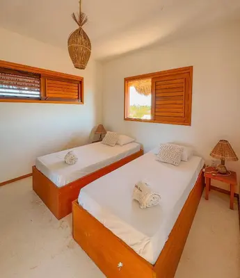 Uma cama ou camas num quarto em La Villa Dune, um luxo com vista espetacular por mar e coqueiral ! Uma experiência unica !