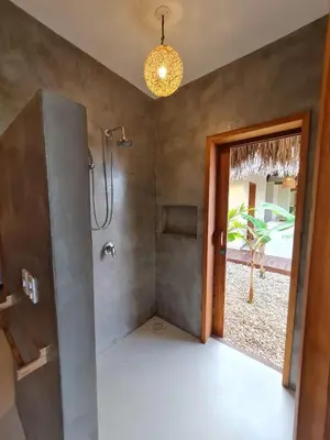 Uma cama ou camas num quarto em La Villa Dune, um luxo com vista espetacular por mar e coqueiral ! Uma experiência unica !