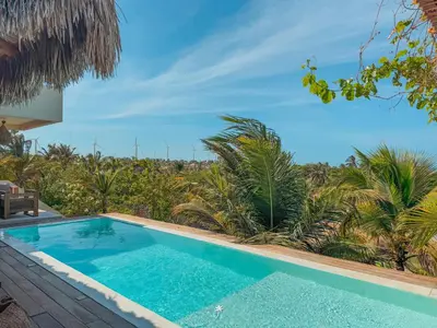 A piscina em ou perto de La Villa Dune, um luxo com vista espetacular por mar e coqueiral ! Uma experiência unica !