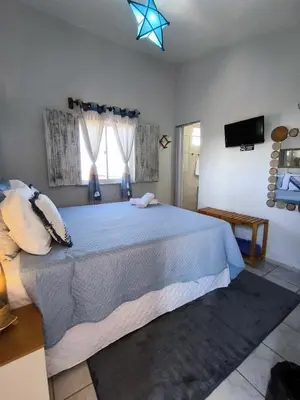 Uma cama ou camas num quarto em Hospedaria Mandacaru