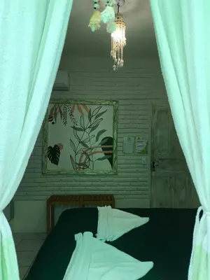 Uma cama ou camas num quarto em Hospedaria Mandacaru