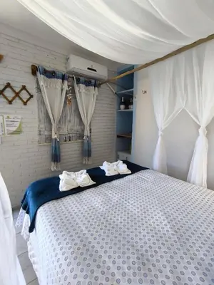 Uma cama ou camas num quarto em Hospedaria Mandacaru
