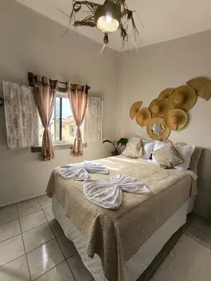 Uma cama ou camas num quarto em Hospedaria Mandacaru