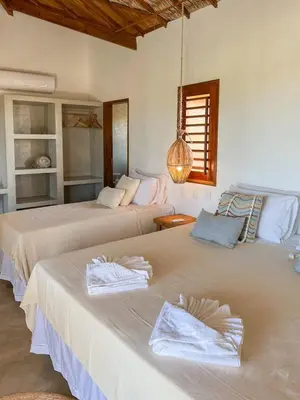 Uma cama ou camas num quarto em Casa Vannina uma casa encantadora em Icaraizinho !