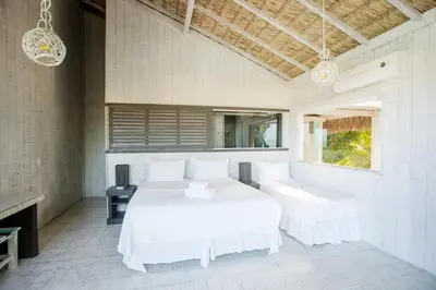 Uma cama ou camas num quarto em Beach Houses Moitas
