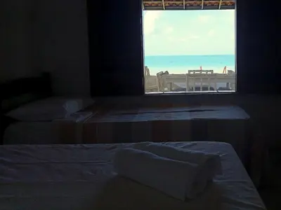 Uma cama ou camas num quarto em Casa dos Ximenes - Beira Mar da Taíba - Ótima localização