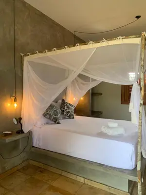 Uma cama ou camas num quarto em Vila Kavaju Preá