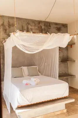 Uma cama ou camas num quarto em Vila Kavaju Preá