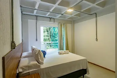 Uma cama ou camas num quarto em Antiquus ApartHotel