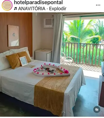 Uma cama ou camas num quarto em Paradise Beach