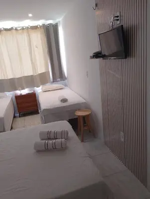 Uma cama ou camas num quarto em Paradise Beach