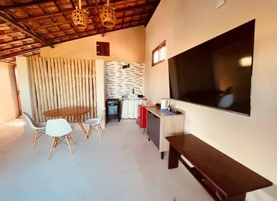 Uma televisão e/ou sistema de entretenimento em Loft Canoa