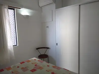 Uma cama ou camas num quarto em Vila Costeira Beira Mar 104 Praia do Meireles
