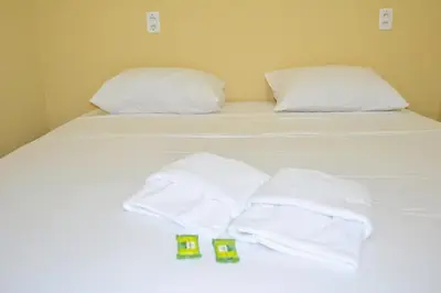 Uma cama ou camas num quarto em Iracema Praia Flats