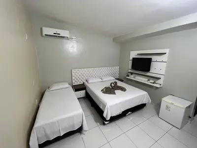 Uma cama ou camas num quarto em Suíte Brisa Mar Villa brisa icaraizinho