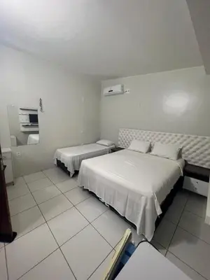 Uma cama ou camas num quarto em Suíte Brisa Mar Villa brisa icaraizinho