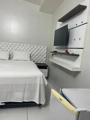 Uma televisão e/ou sistema de entretenimento em Suíte Brisa Mar Villa brisa icaraizinho