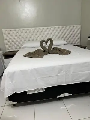 Uma cama ou camas num quarto em Suíte Brisa Mar Villa brisa icaraizinho