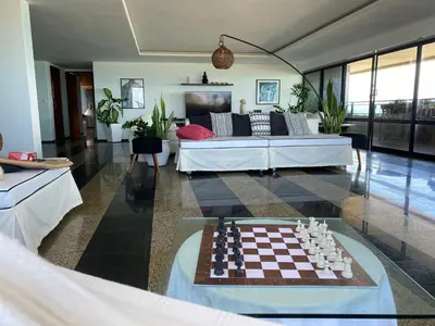 Uma área de estar em Apartamento Oceano Praia Fortaleza