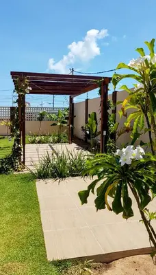 Um jardim no exterior de Apto Beira Mar 1802 - Praia Futuro