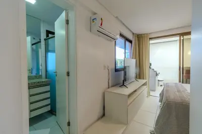 Uma televisão e/ou sistema de entretenimento em Mandara Lanai Apartamento Bangalô