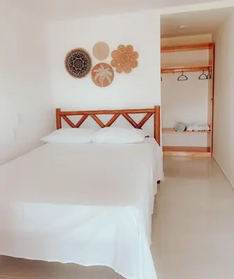 Uma cama ou camas num quarto em POUSADA OBAH VILLAGE