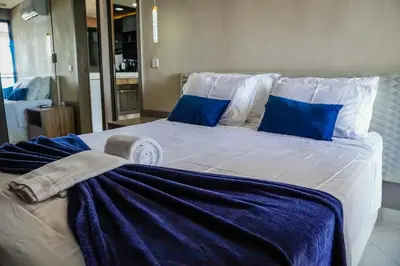 Uma cama ou camas num quarto em Beira Mar Fortaleza Landscape