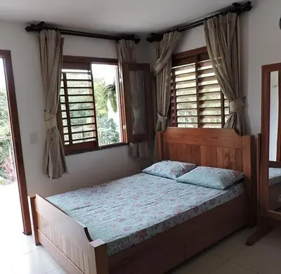Uma cama ou camas num quarto em TRIPLEX SOLAR CASA BRANCA