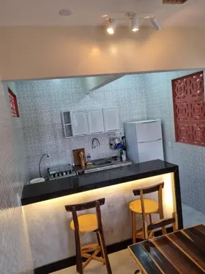 A cozinha ou kitchenette de Duplex de 2 quartos com ar condicionado , piscina e estacionamento