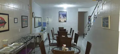 Uma área de estar em Pousada Savoy