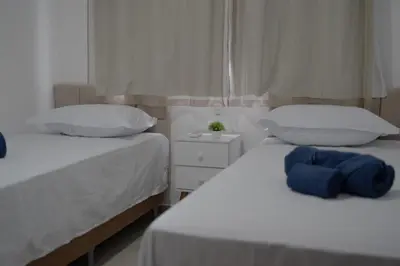 Uma cama ou camas num quarto em CANOA - Boas Vistas
