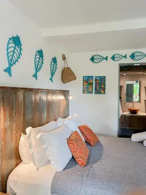 Uma cama ou camas num quarto em Casa Zulu - Vila Umoya