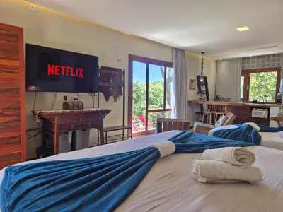 Uma cama ou camas num quarto em Casa da Árvore - Refúgio de Luxo com Jacuzzi e Vista para a Serra