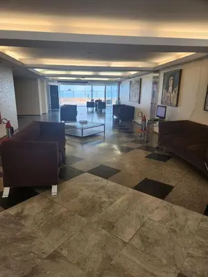 Uma área de estar em Tabajara flats