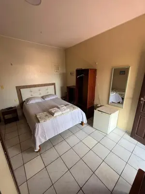 Uma cama ou camas num quarto em Bela Vista