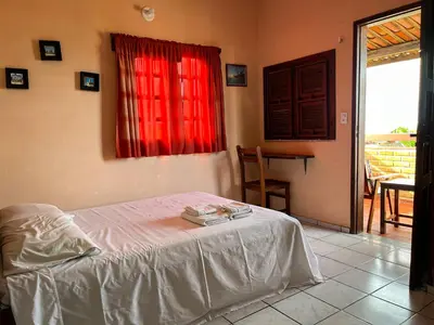 Uma cama ou camas num quarto em Bela Vista