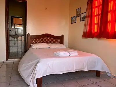 Uma cama ou camas num quarto em Bela Vista