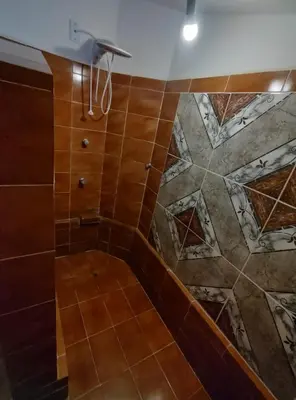Uma casa de banho em Casa no Porto das Dunas Com Vista pro mar