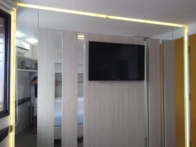 Uma televisão e/ou sistema de entretenimento em Flat particular no Blue Tree Fortaleza