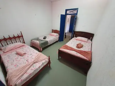 Uma cama ou camas num quarto em Linda casa com banho natural em Guaramiranga