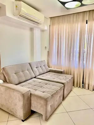 Uma área de estar em Landscape Beira Mar Deluxe Vista Mar