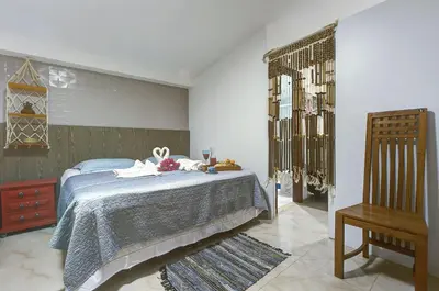 Uma cama ou camas num quarto em Casa Oásis com Sauna, Hidro e Piscina by Carpediem