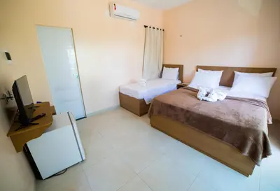 Uma cama ou camas num quarto em Pousada dos Corais